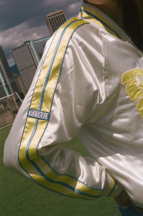 Close-up on the Tombolo patch on the FIFA Souvenir Jacket.