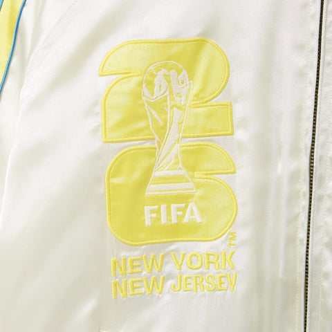 Embroidered FIFA logo on a white jacket with 'New York New Jersey' text.