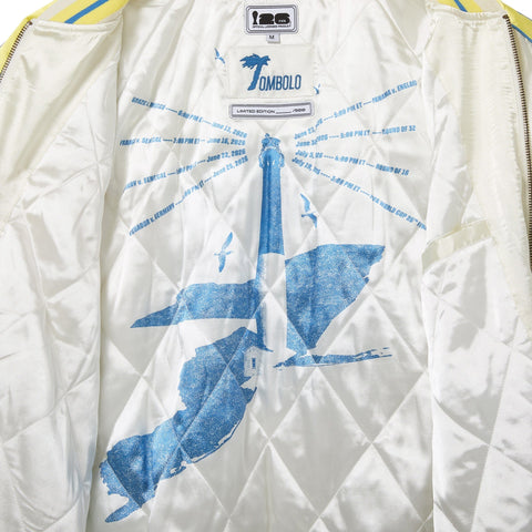 Interior of the FIFA Souvenir Jacket, featuring a lighthouse graphic with match dates written around.