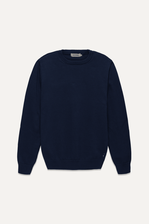 A dark navy blue crewneck sweater displayed flat against a light off-white background - Inkerman NYC