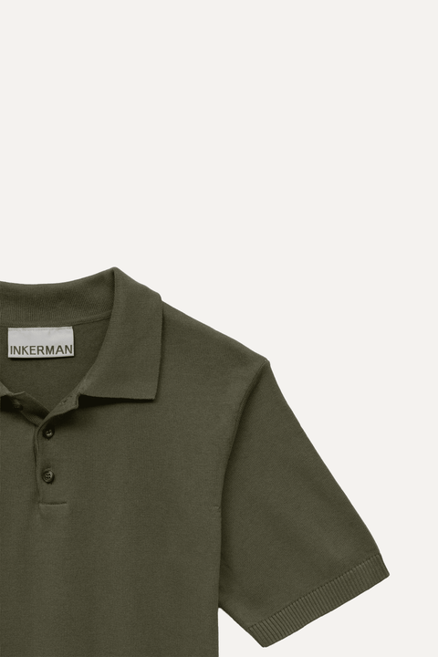 Close-up of a short-sleeve polo shirt in olive green, showing the collar, two-button placket - Inkerman NYC