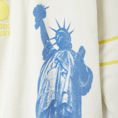 Blue silhouette of the Statue of Liberty.