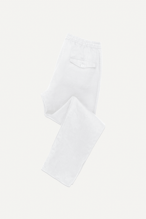 White linen pants with an elastic waistband shown flat on a light cream background - Inkerman NYC